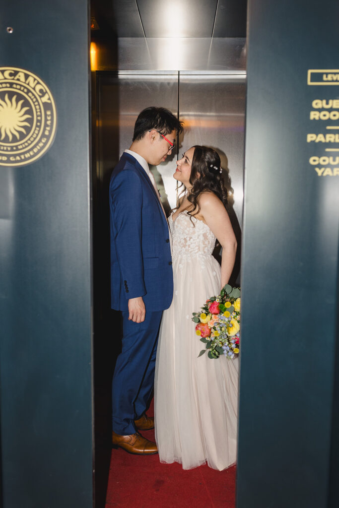 bride and groom elevator photography at no vacancy kansas city