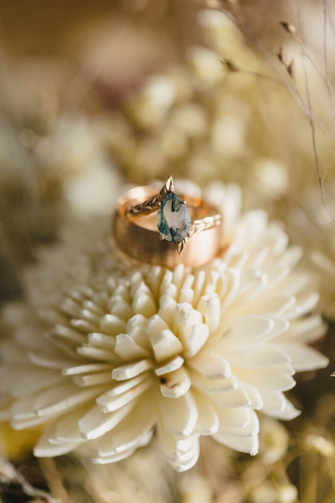 wedding florals and wedding rings close up