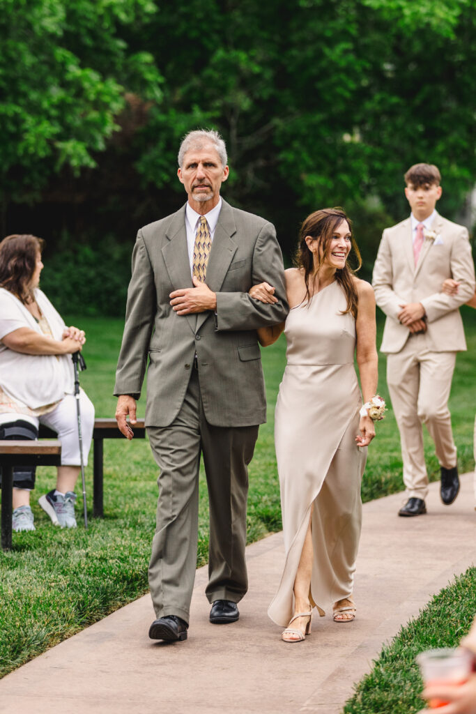 wedding ceremony details couples walking down the aisle