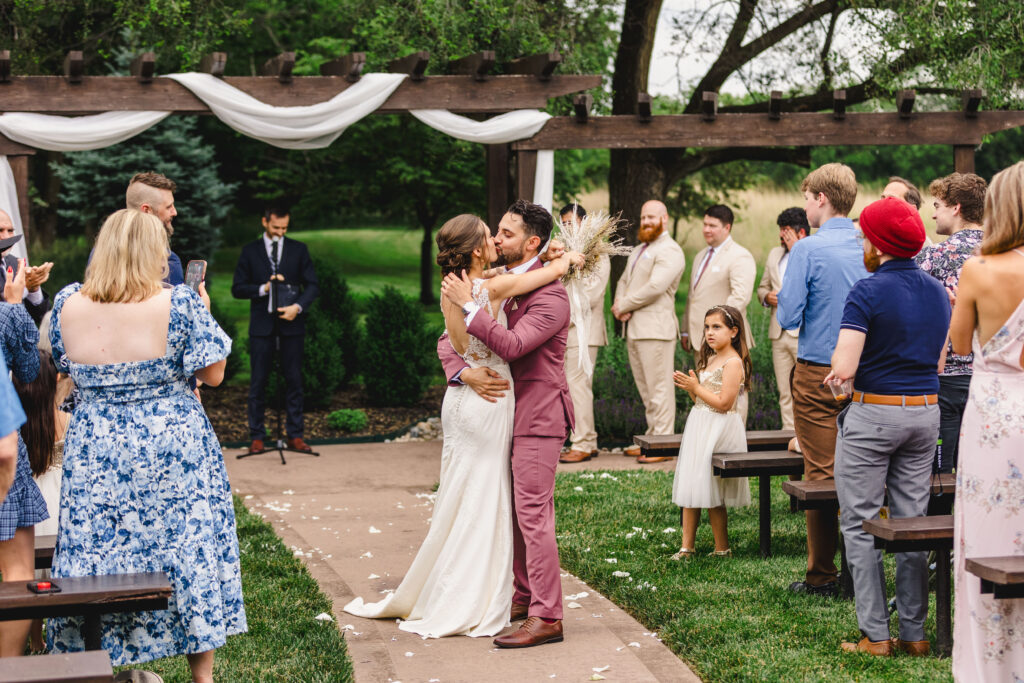 bride and groom get married at outdoor ceremony