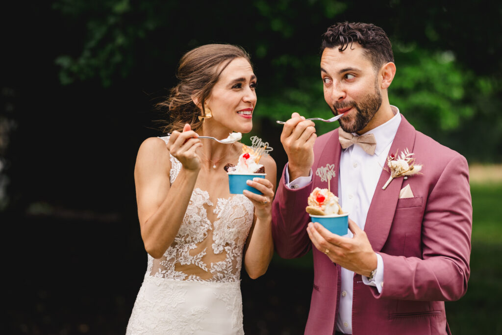 bride and groom eating ice cream to end their wedding day