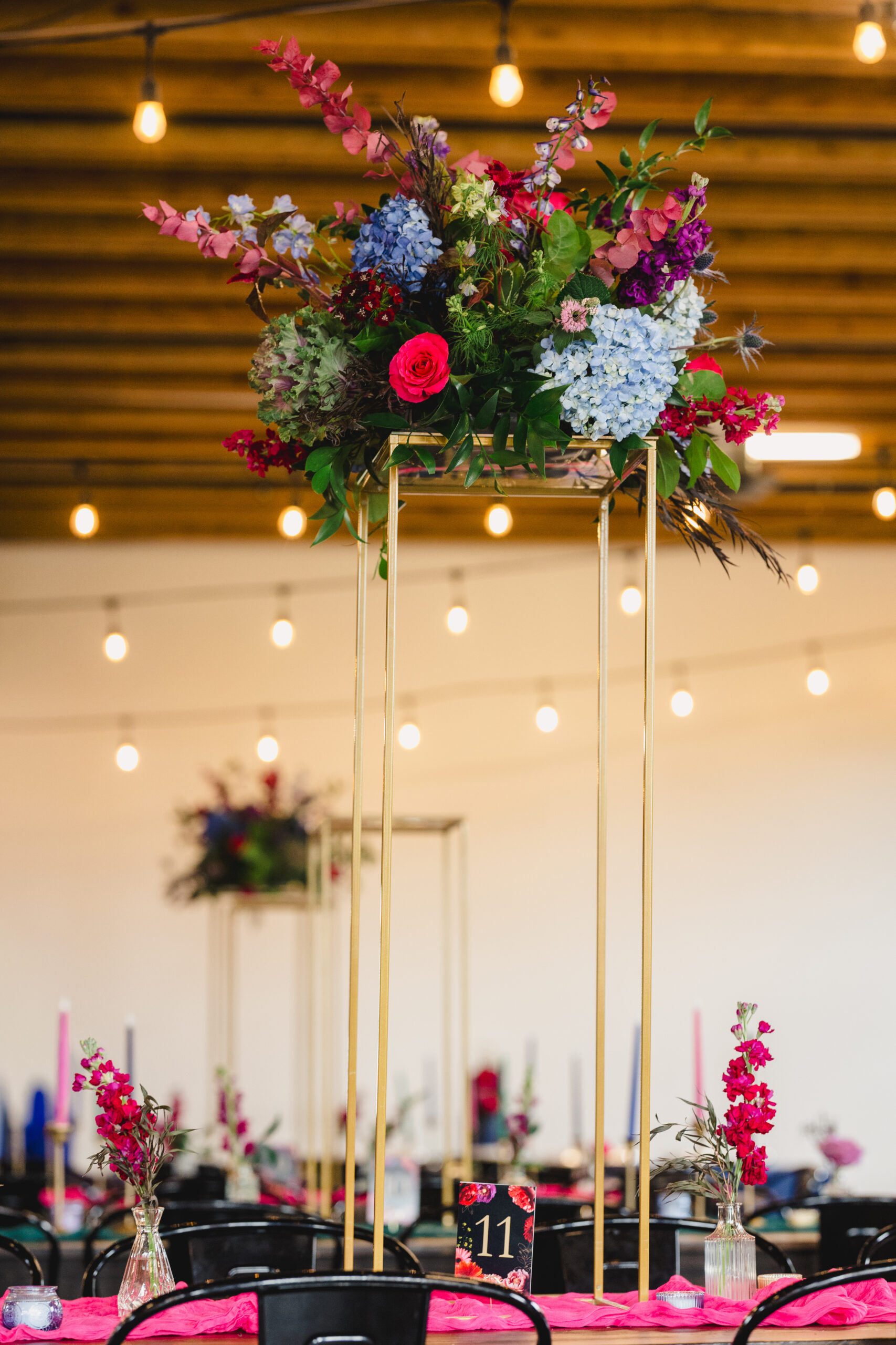 a floral arrangement in the middle of a table inside of union in kansas city 
