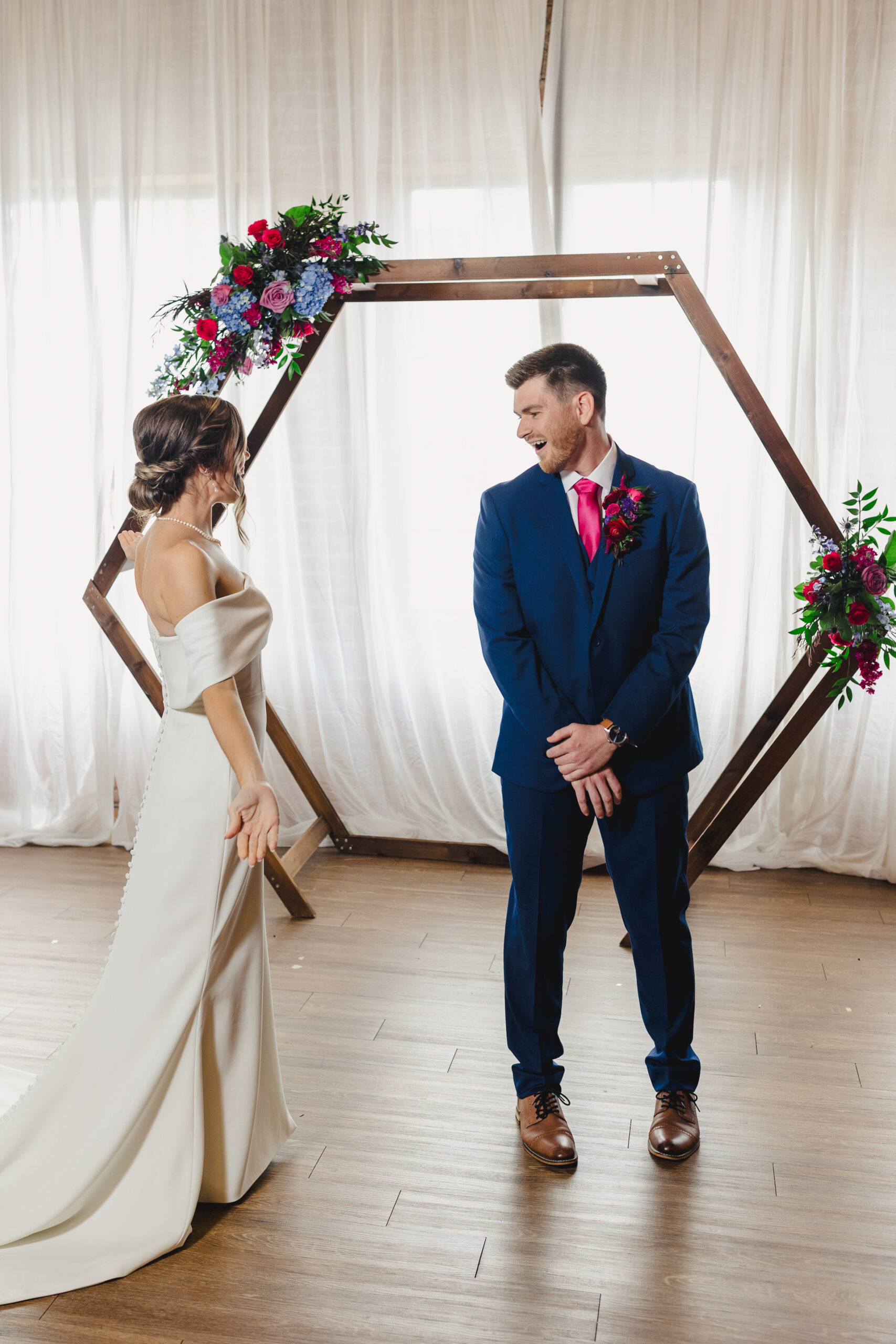 a bride and groom sharing a first look together on the day of their wedding