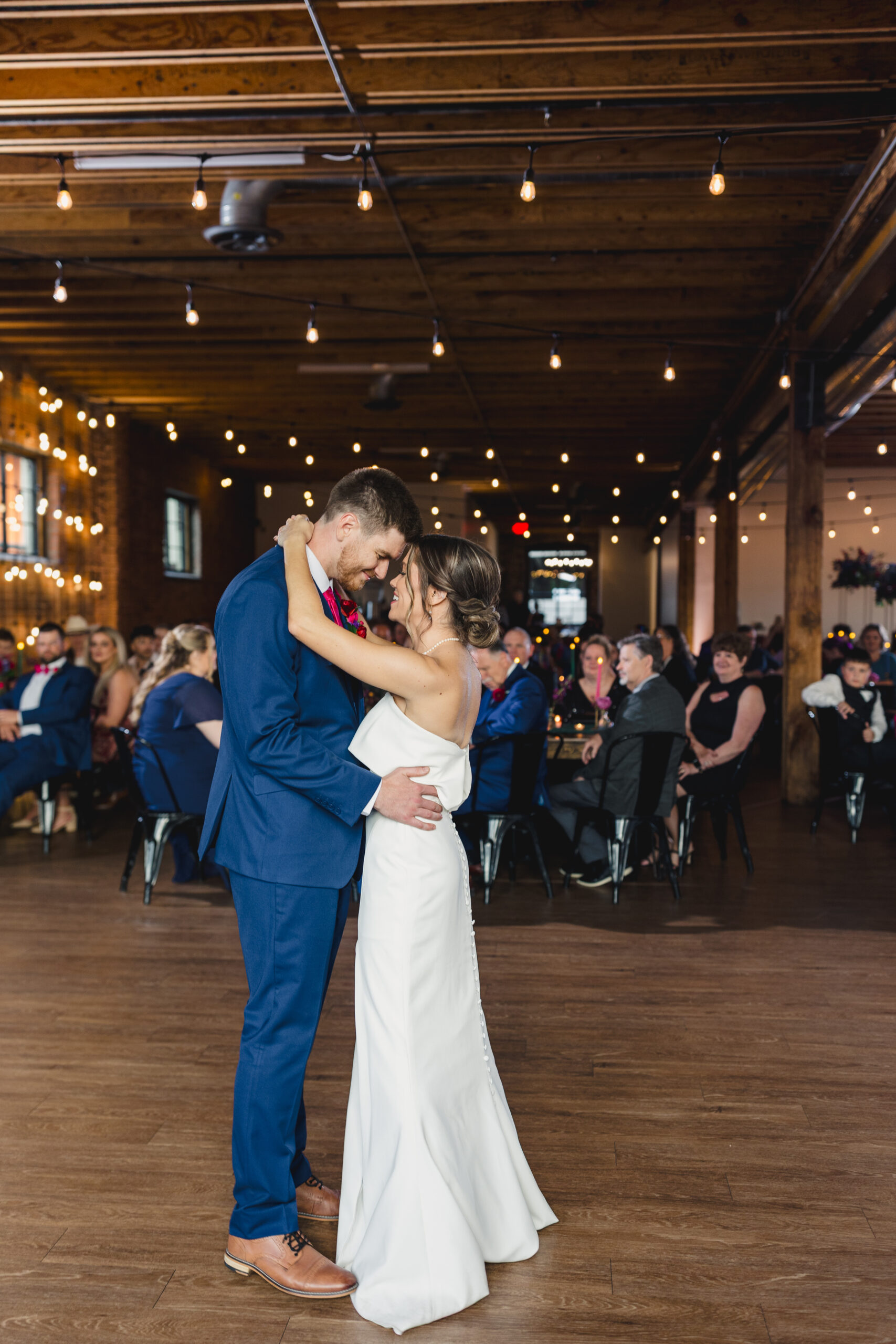 a couple sharing their first dance together in union in kansas city