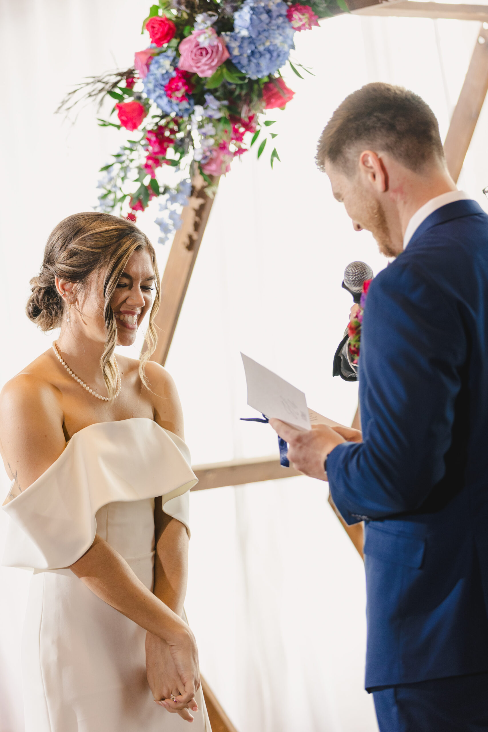 a couple laughing with one another at their wedding ceremony in union in kansas city 
