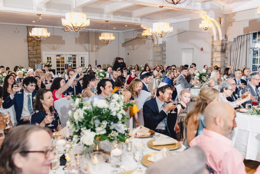 wedding guests seated at a wedding reception inside of the elms hotel in kansas city 