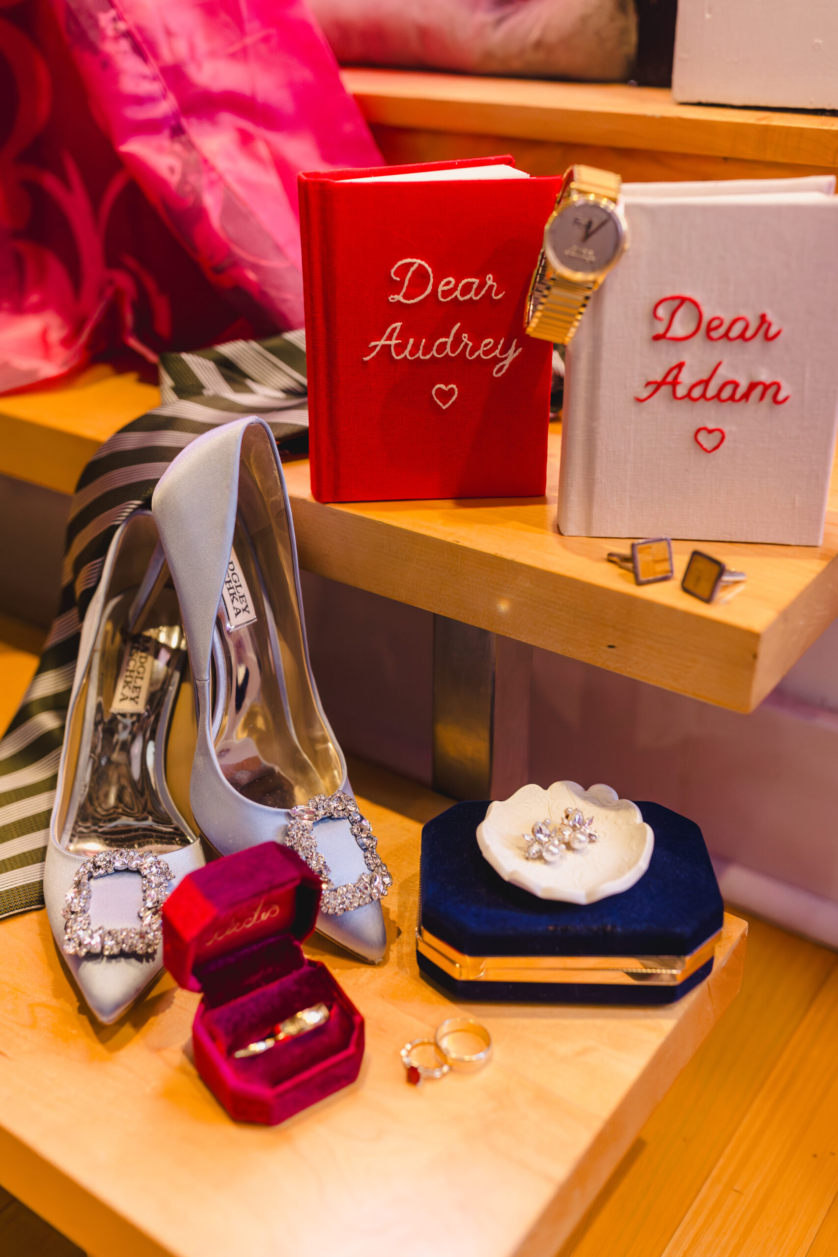 two vow boos, a watch, rings, and heels 