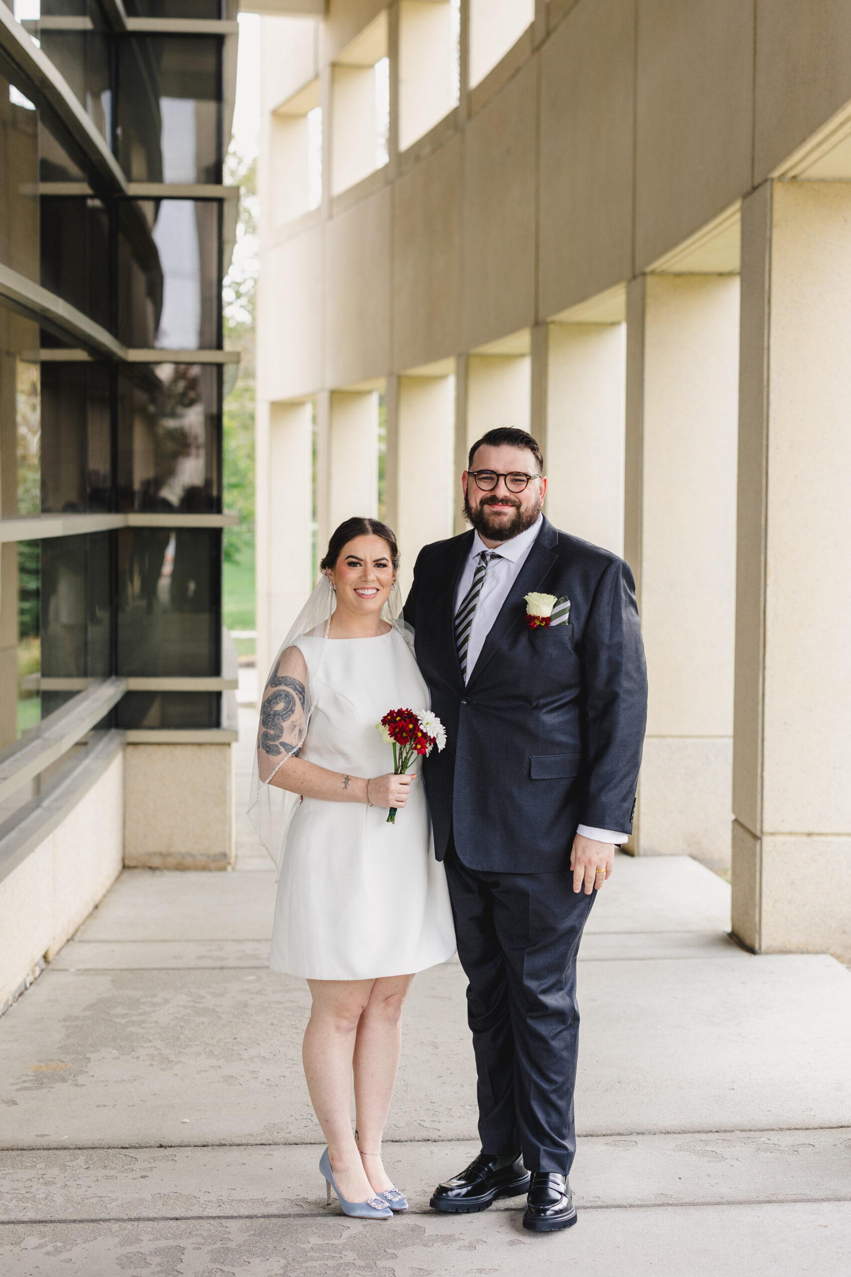 a bride and froom taking couple portraits on the day of their wedding