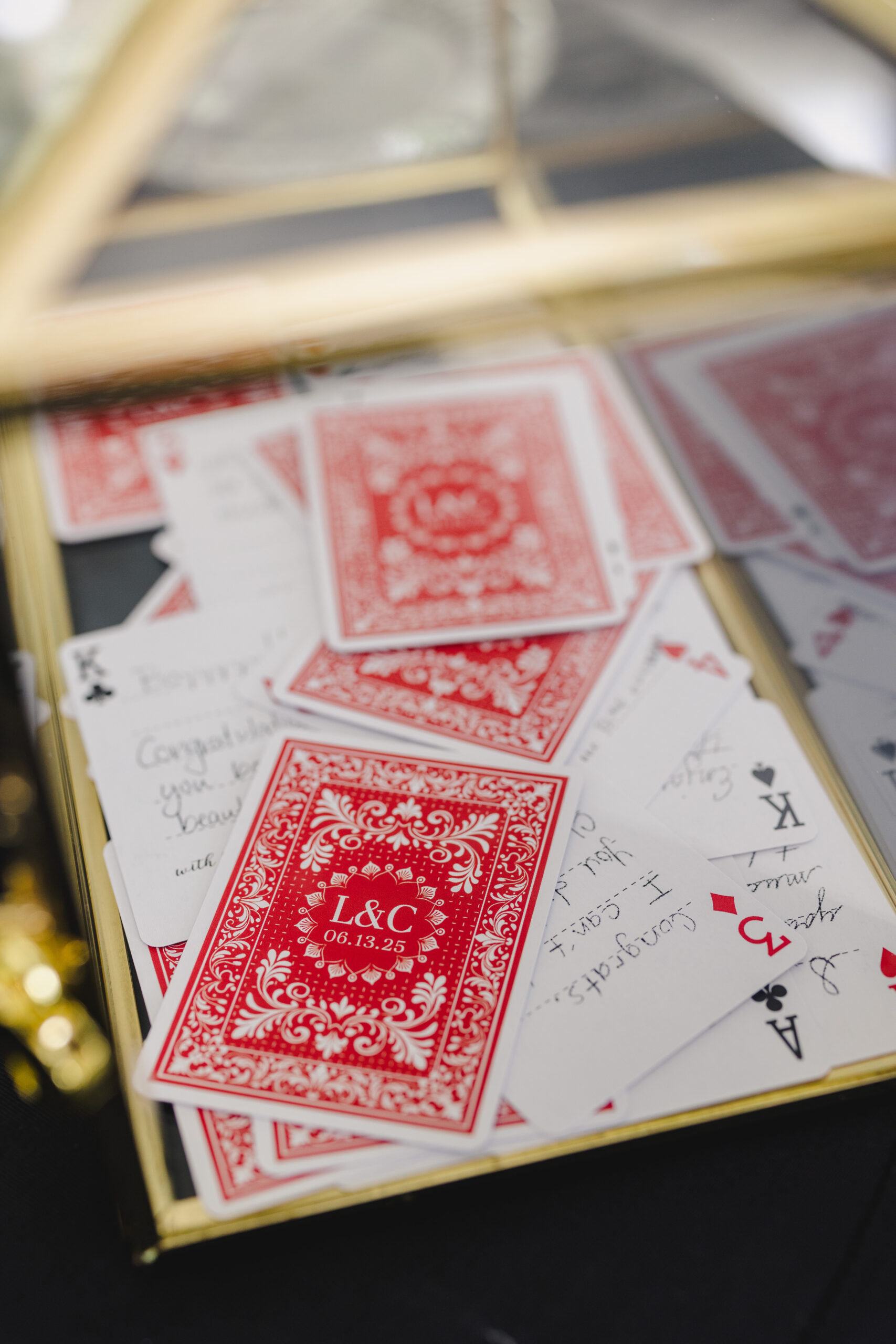 engraved playing cards in a gold case 