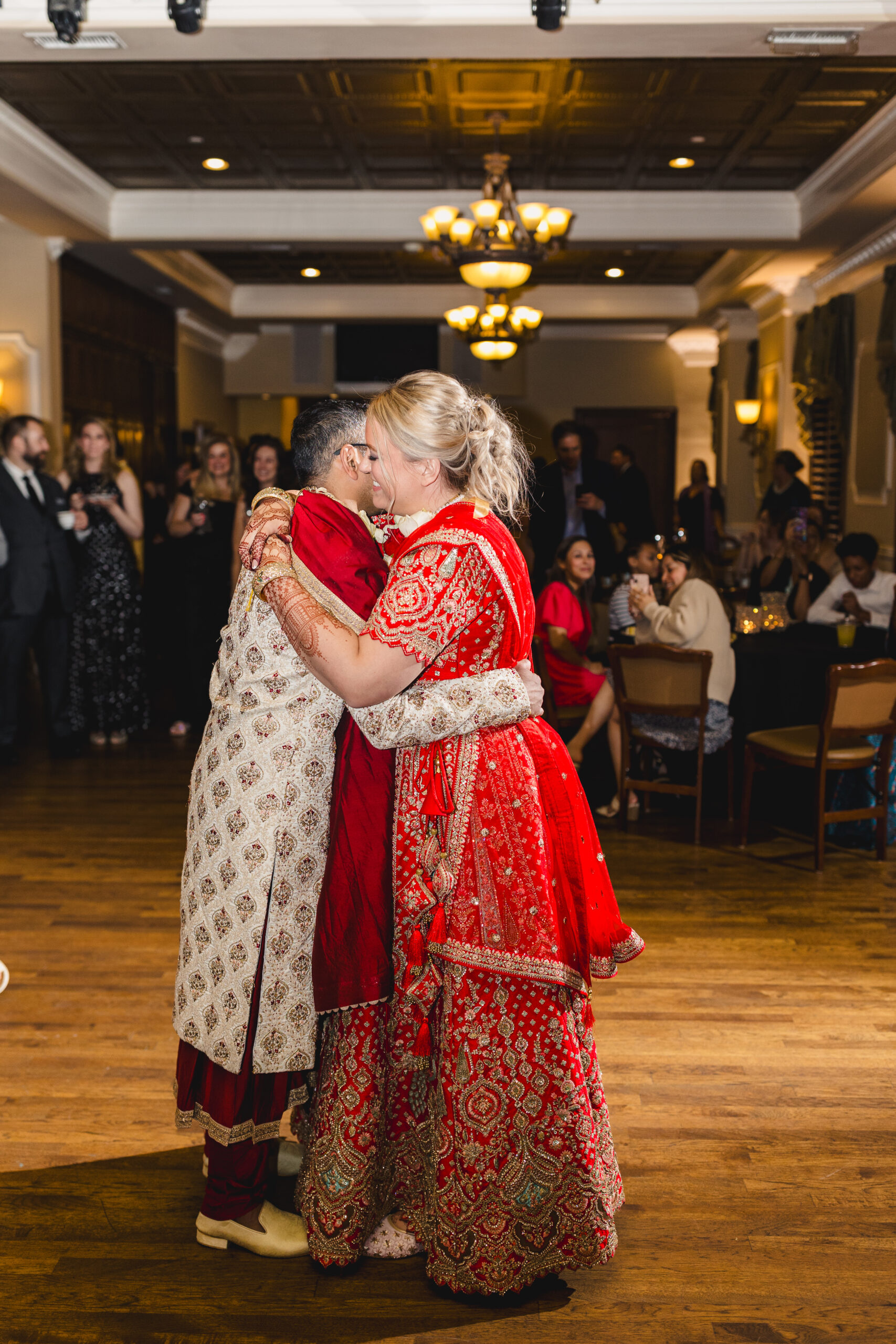 a couple sharing their first dance inside of loose mansion 