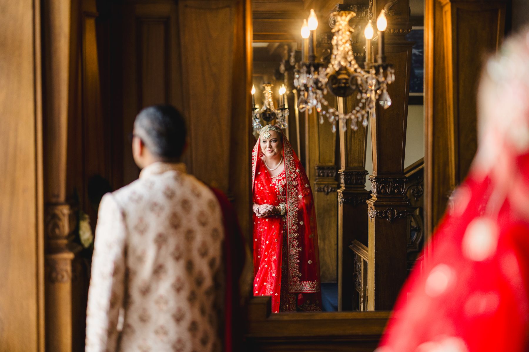 a couple sharing a first look on the day of their wedding inside of loose mansion in kansas city