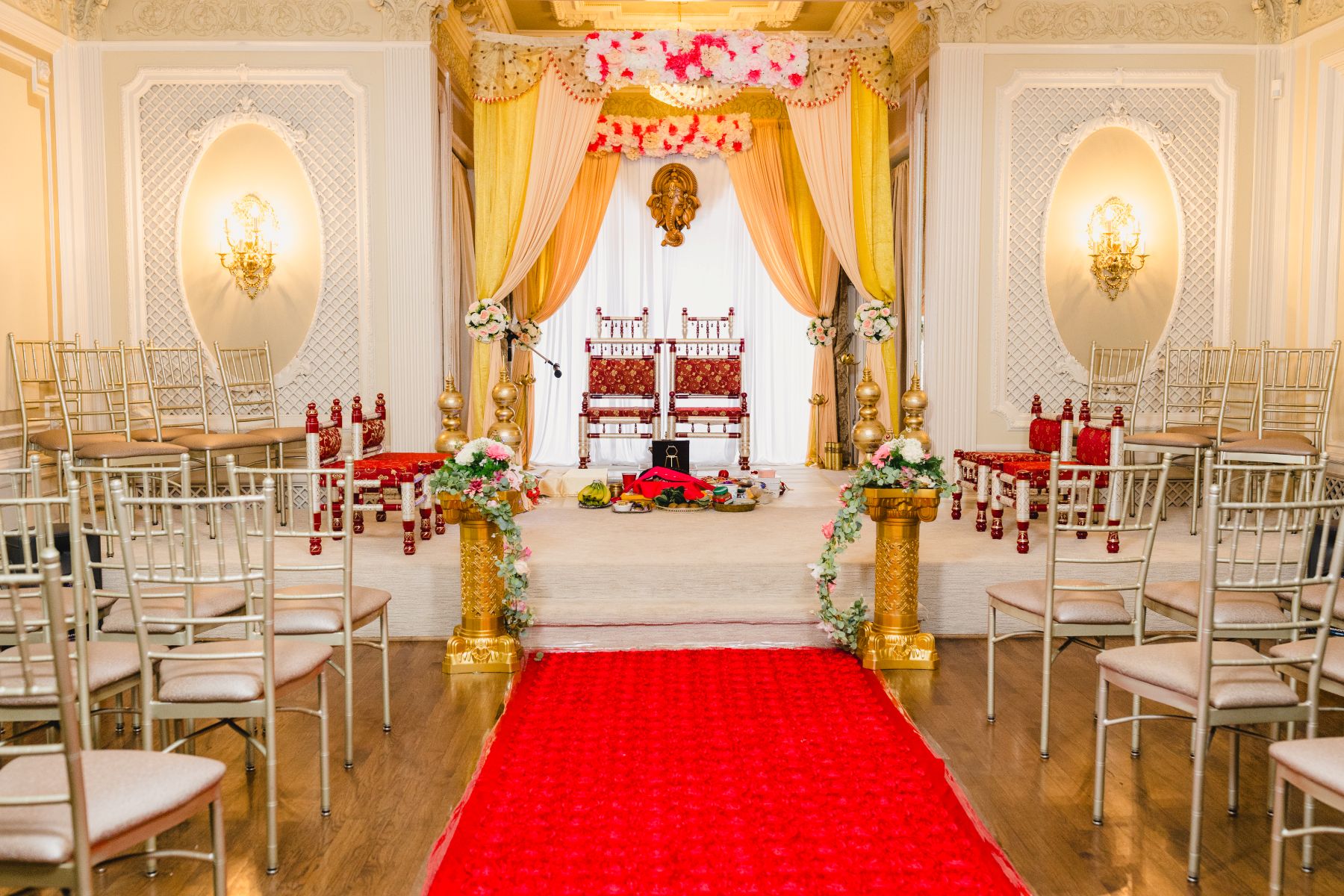 chairs set up for a ceremony inside of loose mansion 
