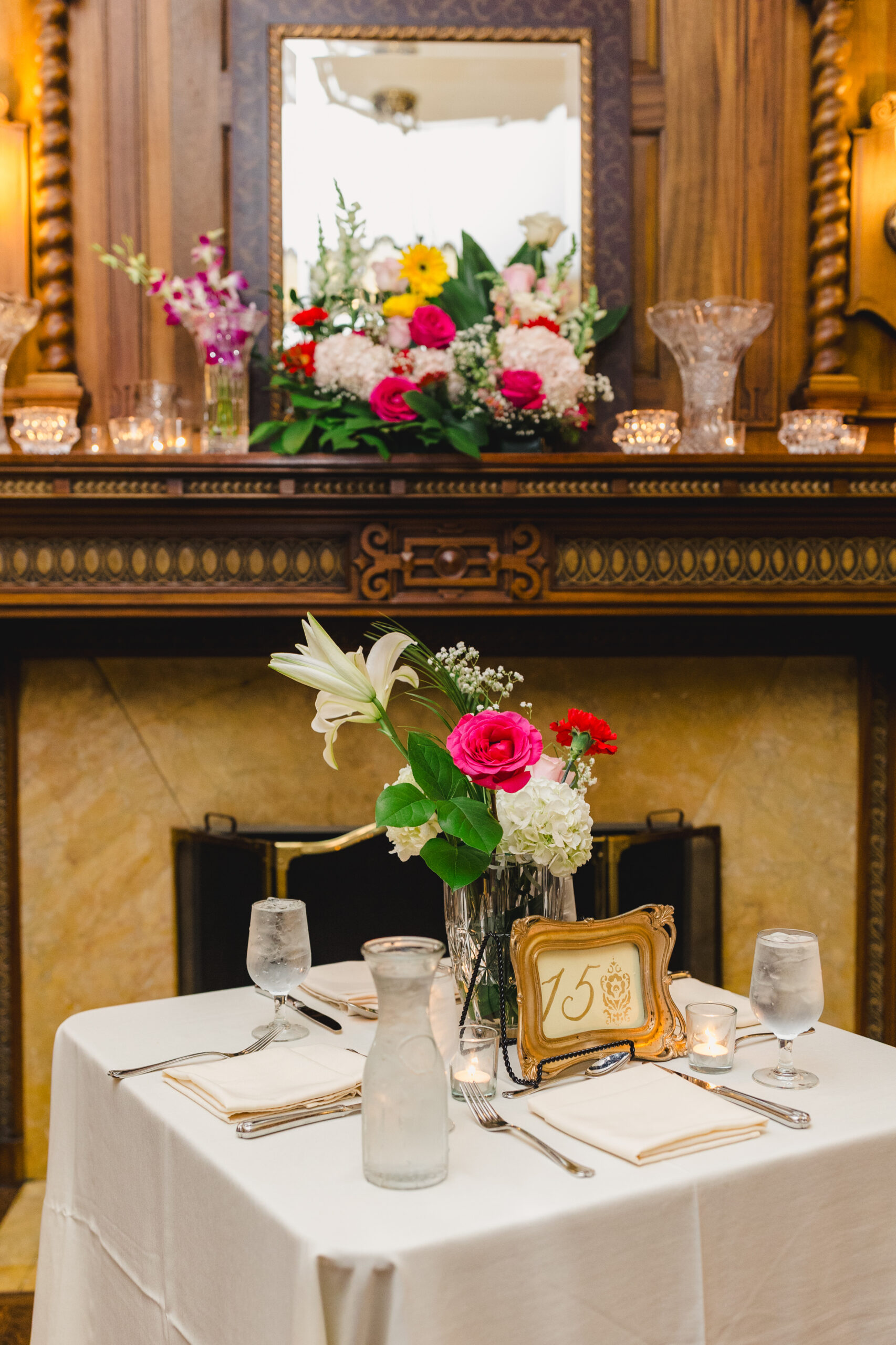 a table set up inside of loose mansion for a wedding ceremony