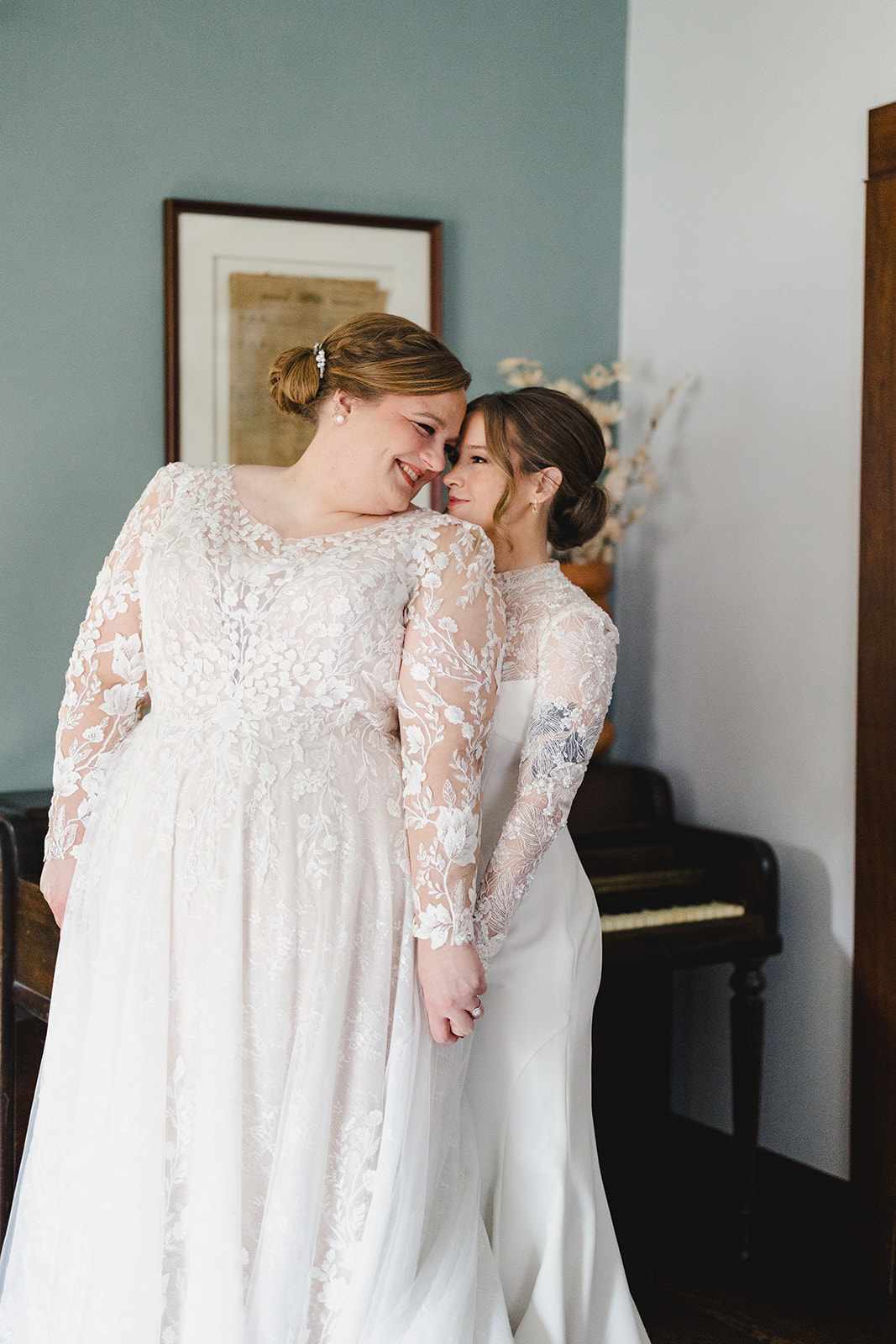 two brides taking wedding portraits together 