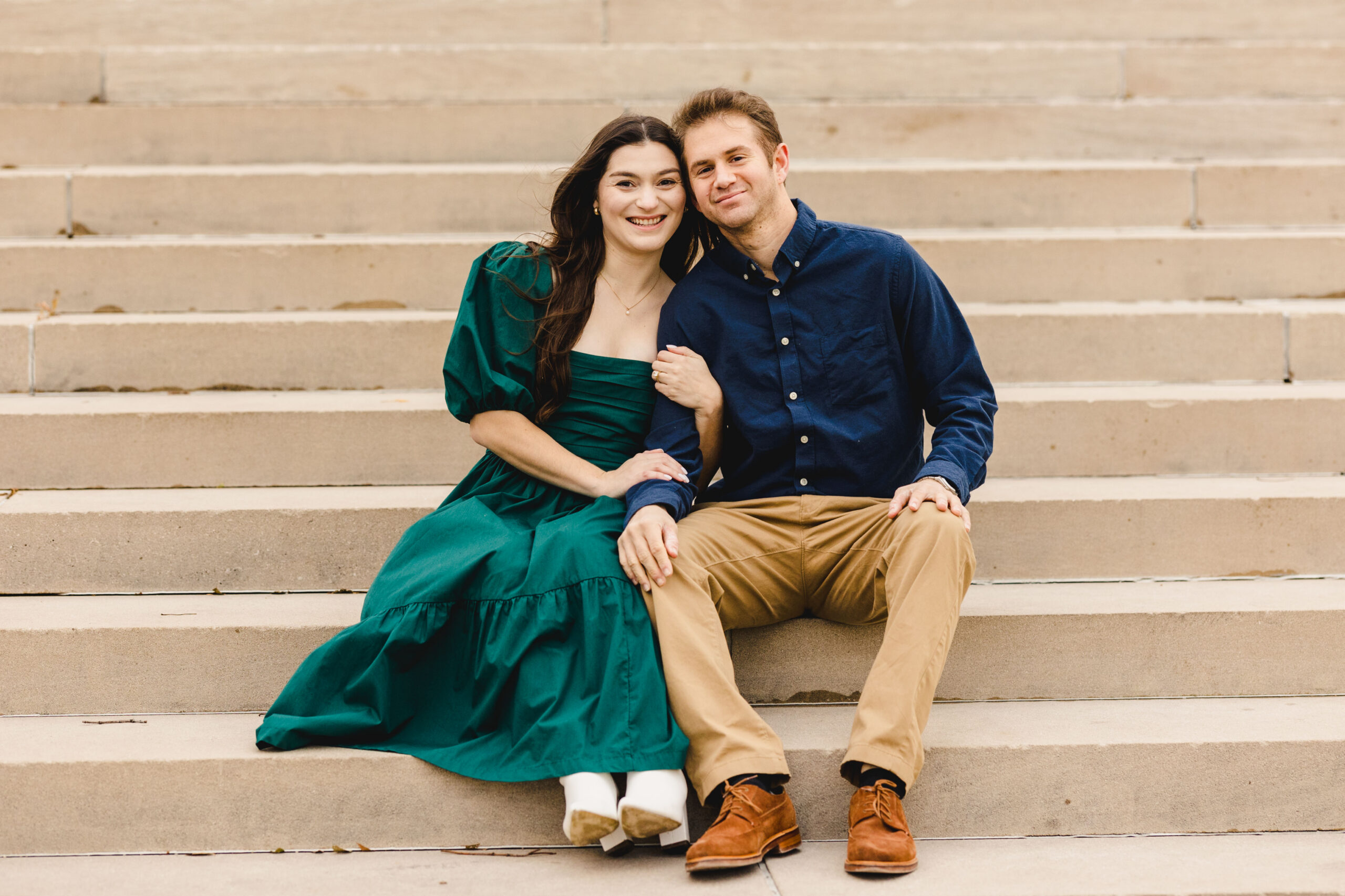 a couple sitting on steps together 
