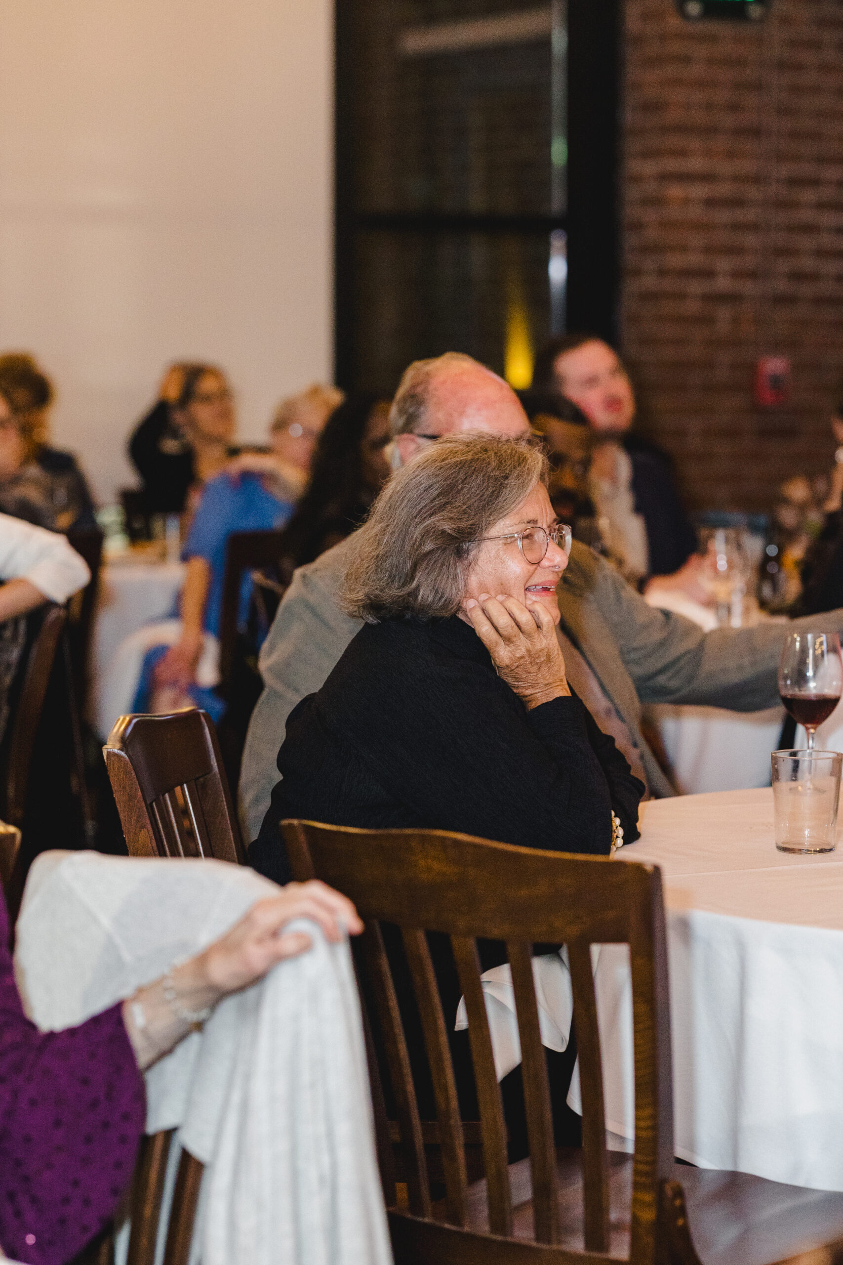 guests sitting at tables at a wedding rehearsal dinner in lidia's in kansas city 