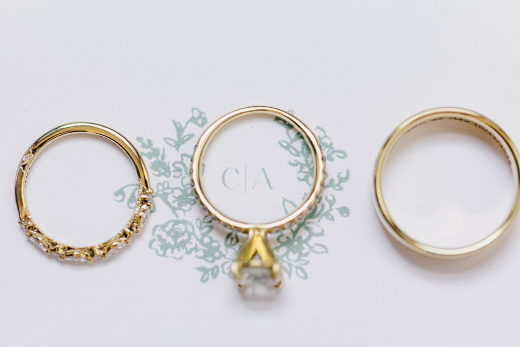 a wedding ring, engagement ring, and wedding band 