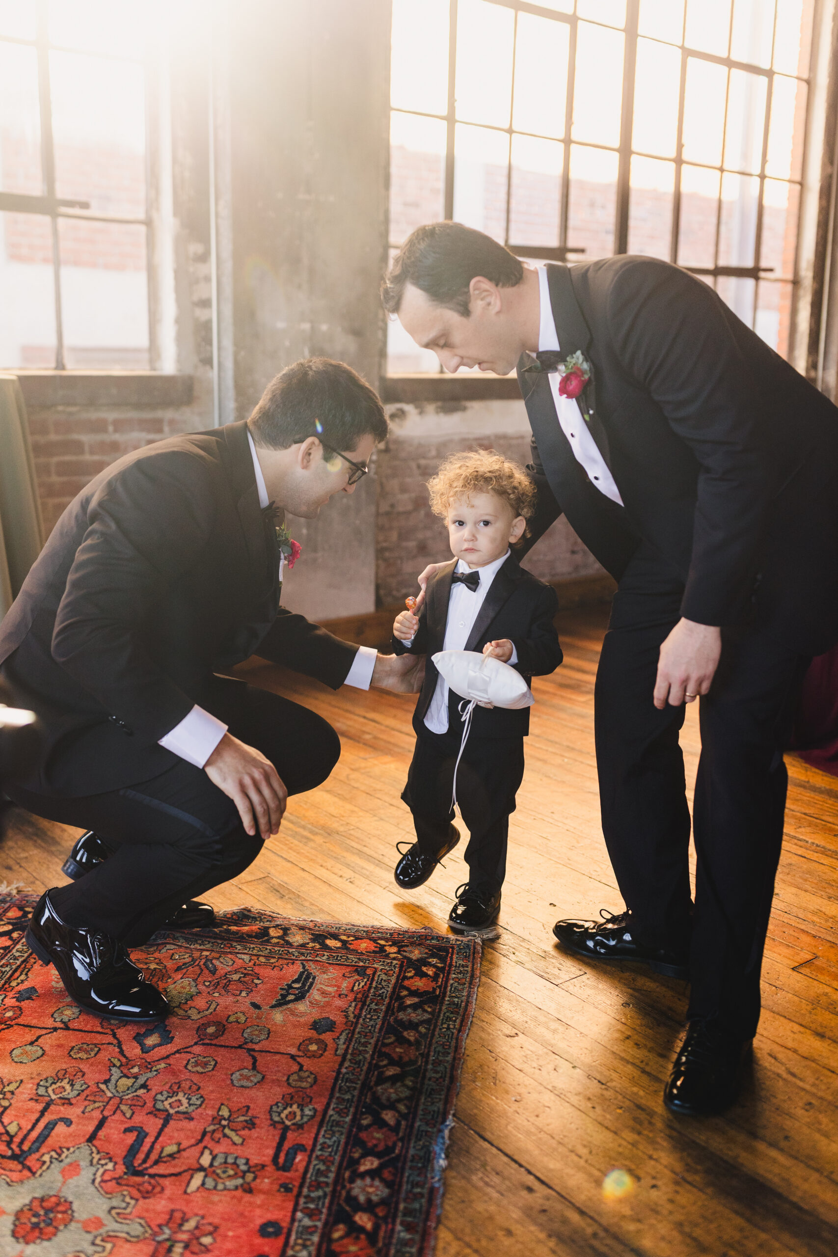 a groom talking to his ring bearer 
