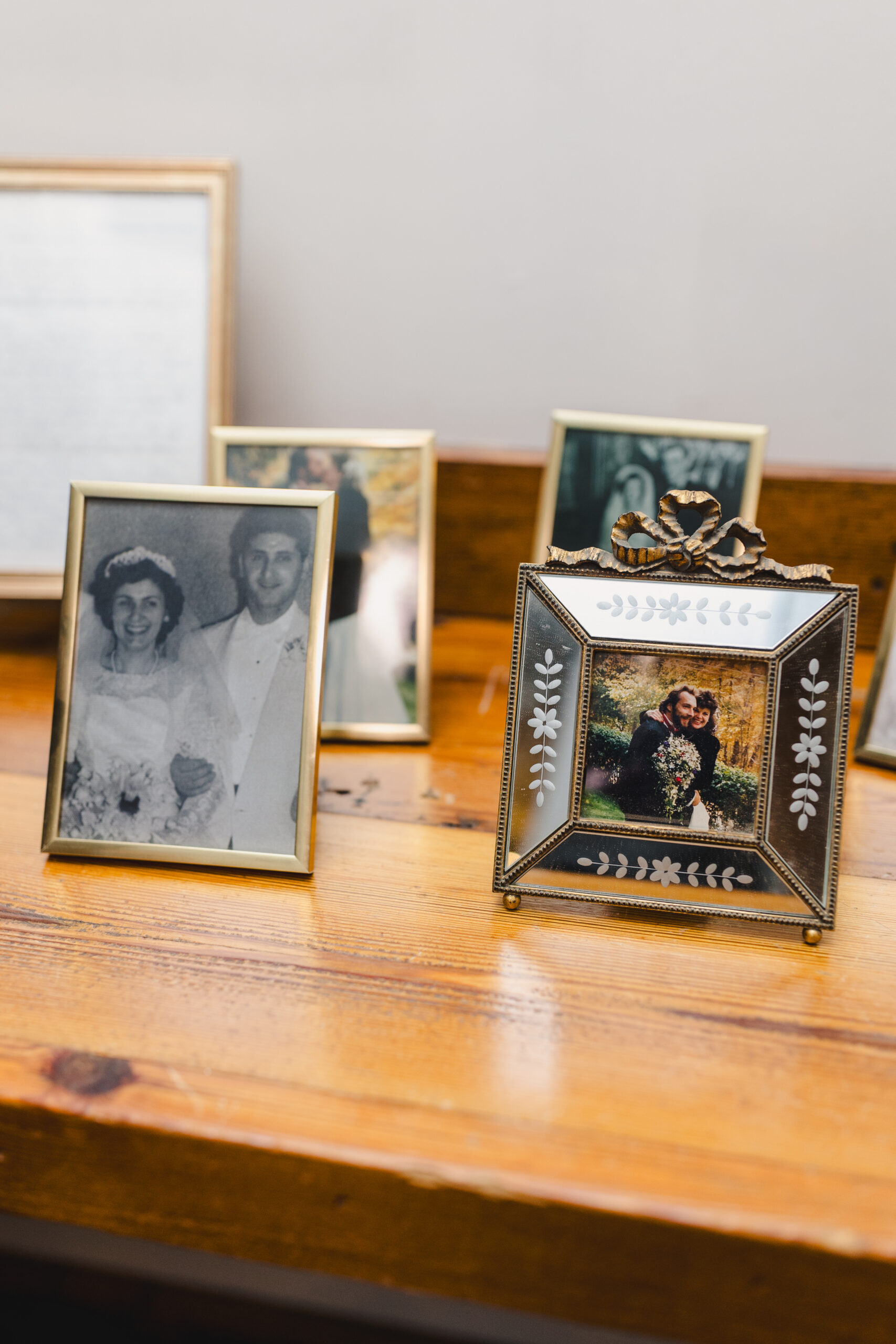 photos of loved ones who have passed on a tablet at a wedding reception 