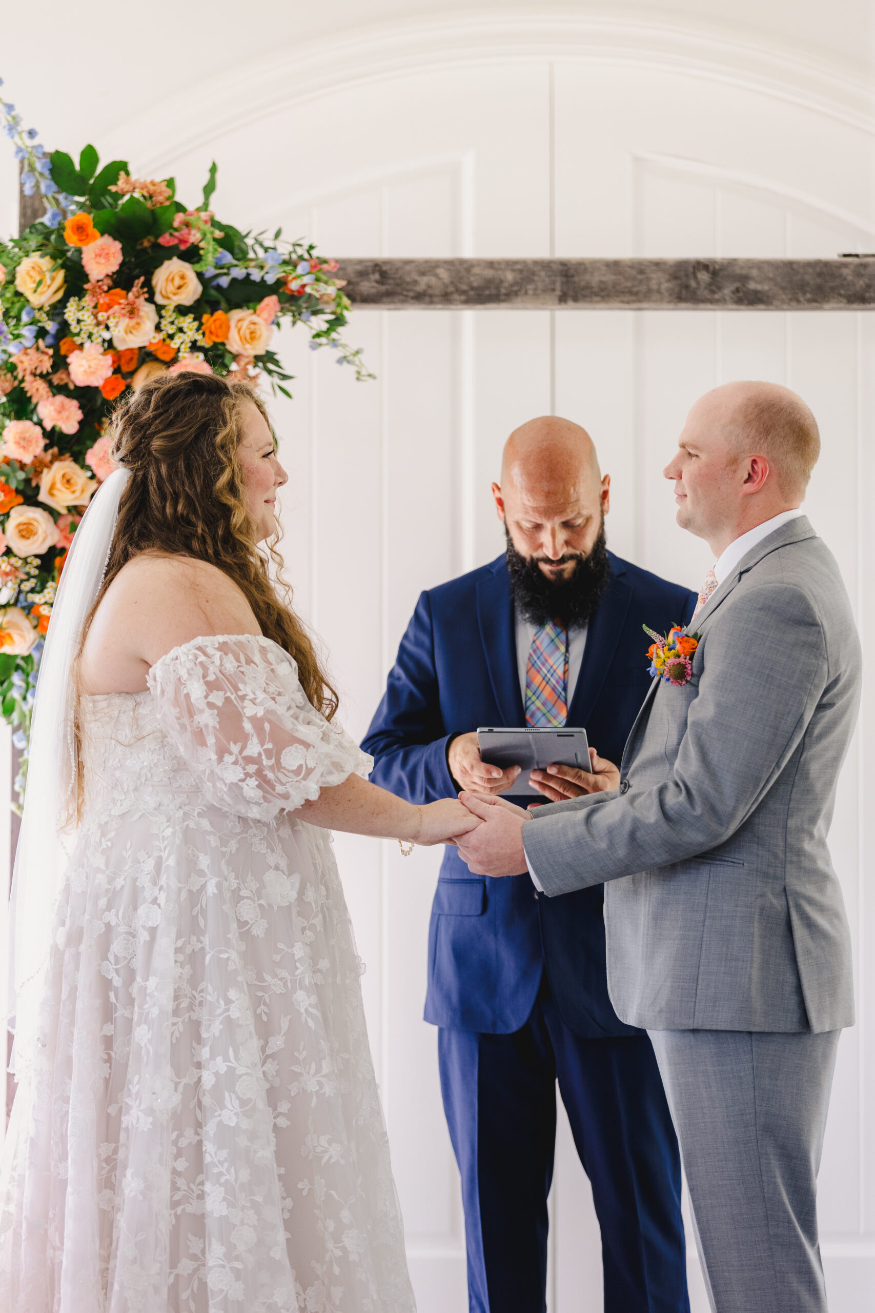 a bride and groom having their wedding ceremony inside of the brim in kansas city