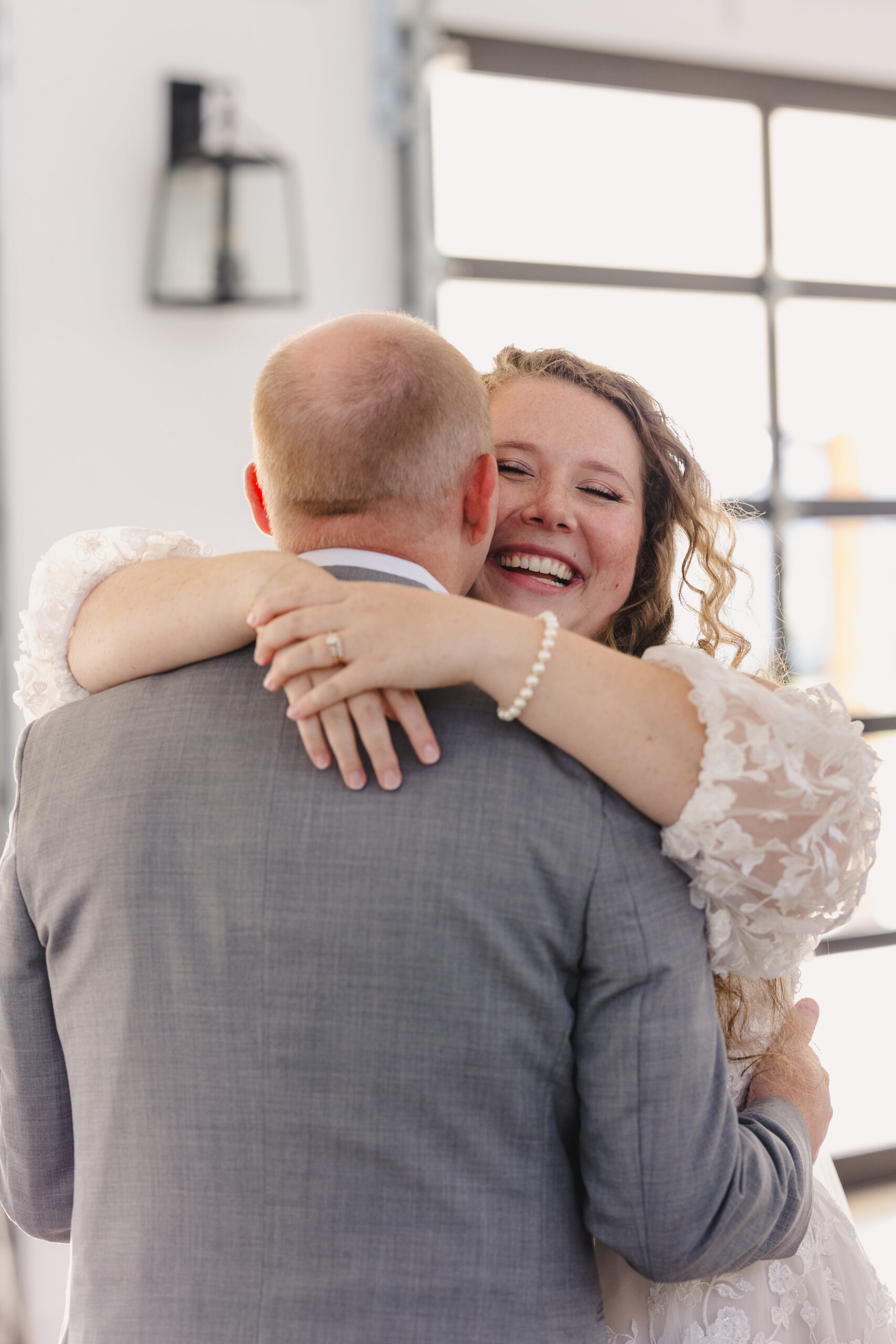 a bride and groom sharing a first dance at their wedding reception 