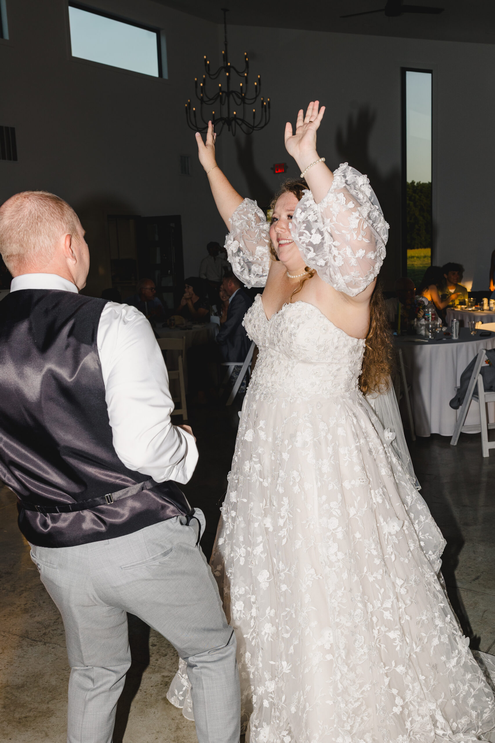 a bride and groom dancing together at their wedding reception 