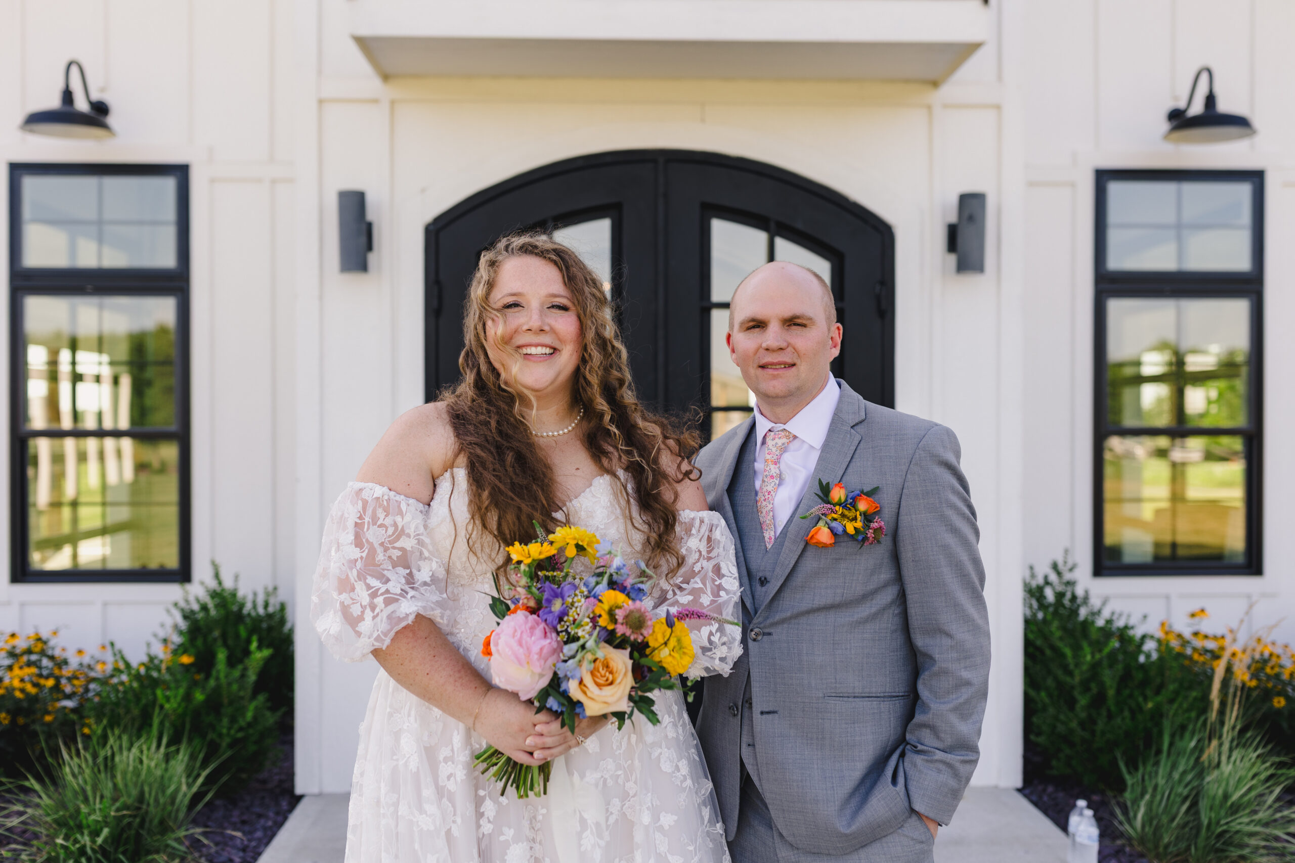 a bride and groom taking wedding portraits 