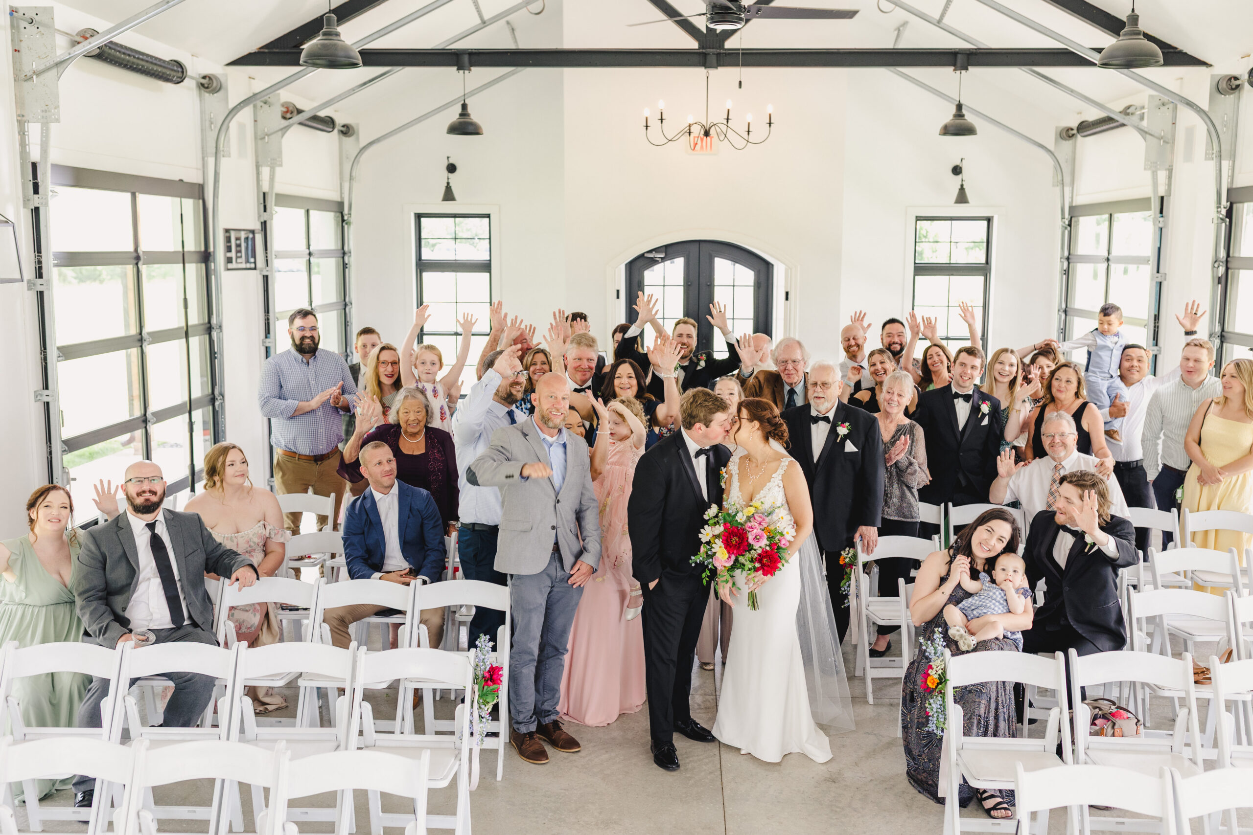 a couple kissing inside the brim in kansas city after their wedding ceremony