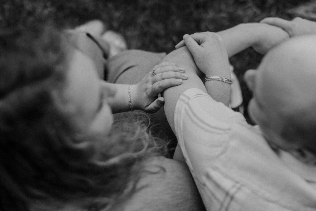 View from above of a couple sitting together with their arms linked