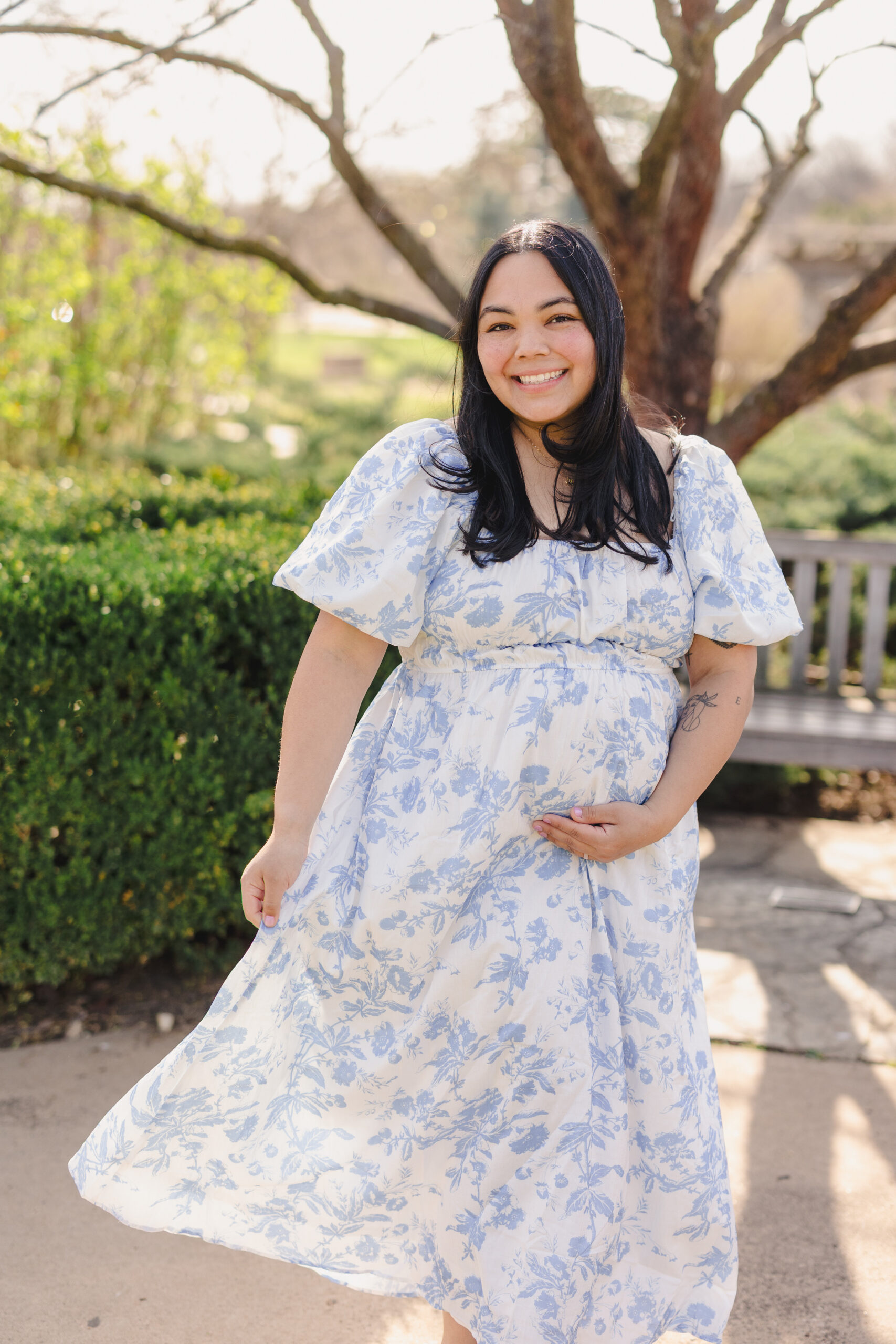 a pregnant woman holding her stomach 