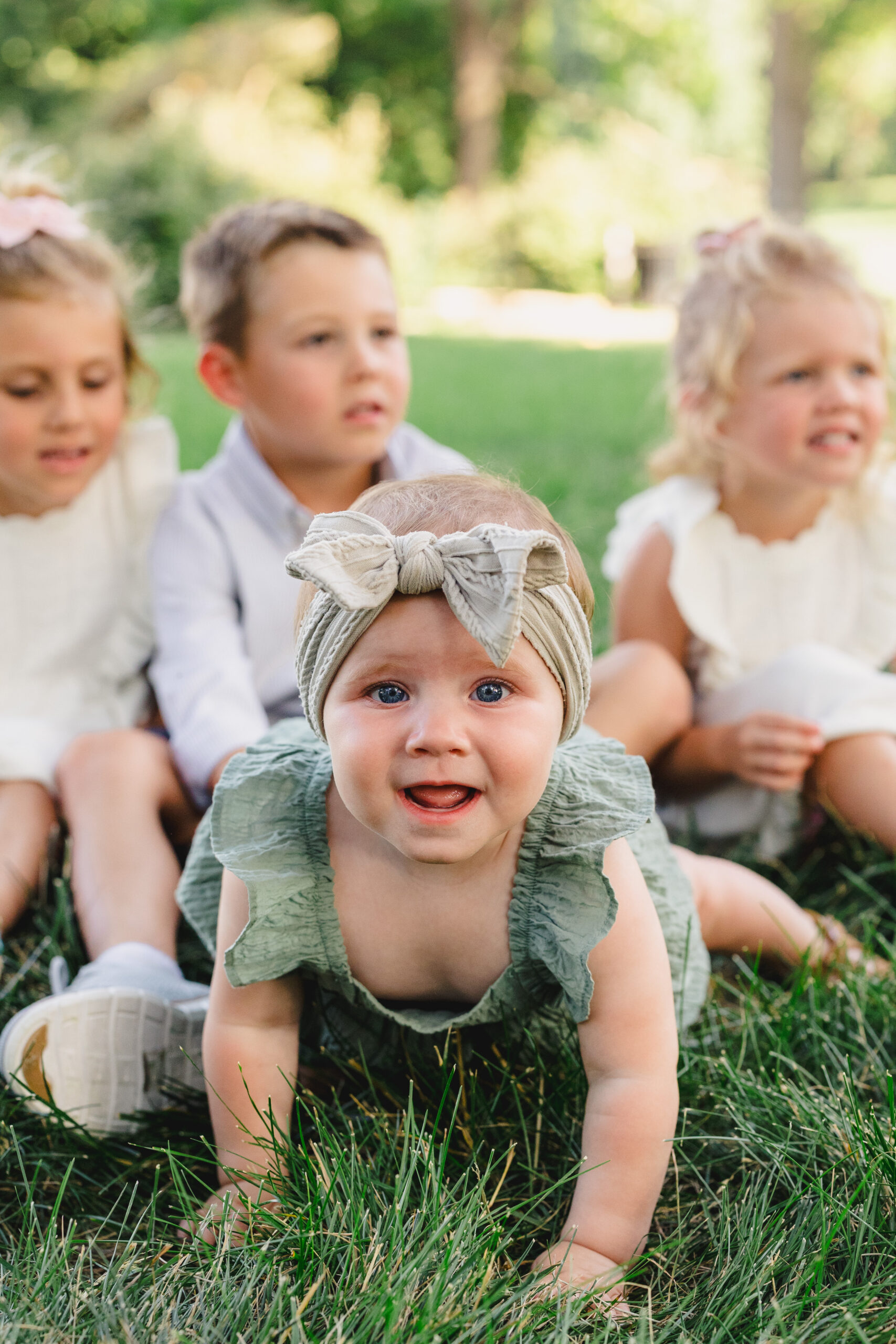 four children in the grass 