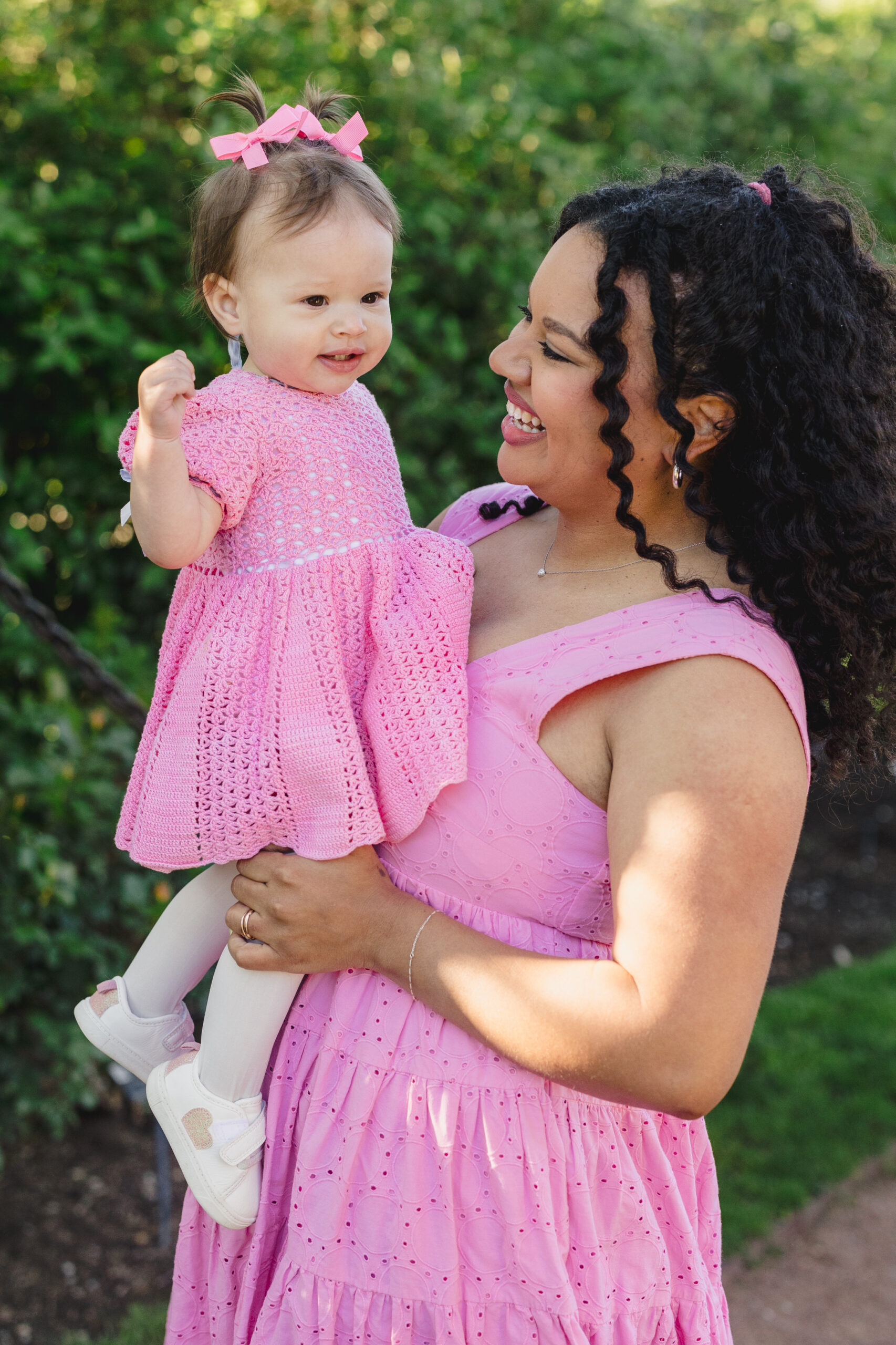 a mother holding her daughter 