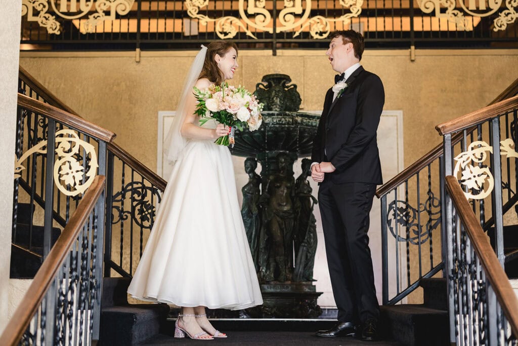 A first look between a bride and groom at the Madrid Theatre in Kansas city