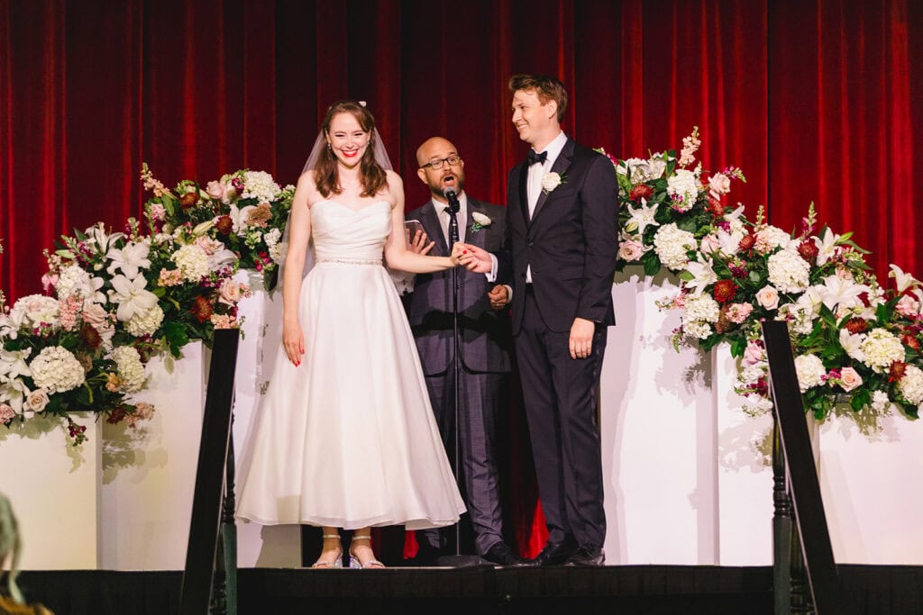 Ceremony in the grand theatre at Madrid Theatre Kansas City wedding venue