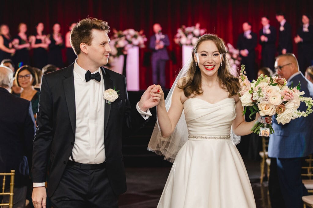 Ceremony in the grand theatre at Madrid Theatre Kansas City wedding venue