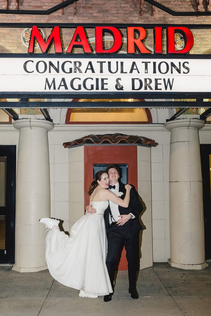 The marquee outside of Madrid Theatre in Kansas City featuring a bride and groom and their names. 