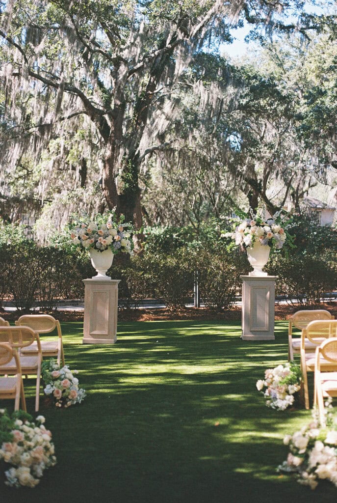 a ceremony set up in Admiral's House in Charleston with the iconic oak moss covered trees in the background