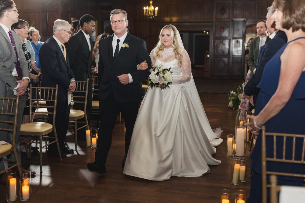 Bride walking down the aisle Tudor Ballroom Hotel Kansas City